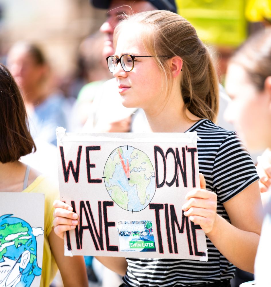 Climate strike protester holding a sign