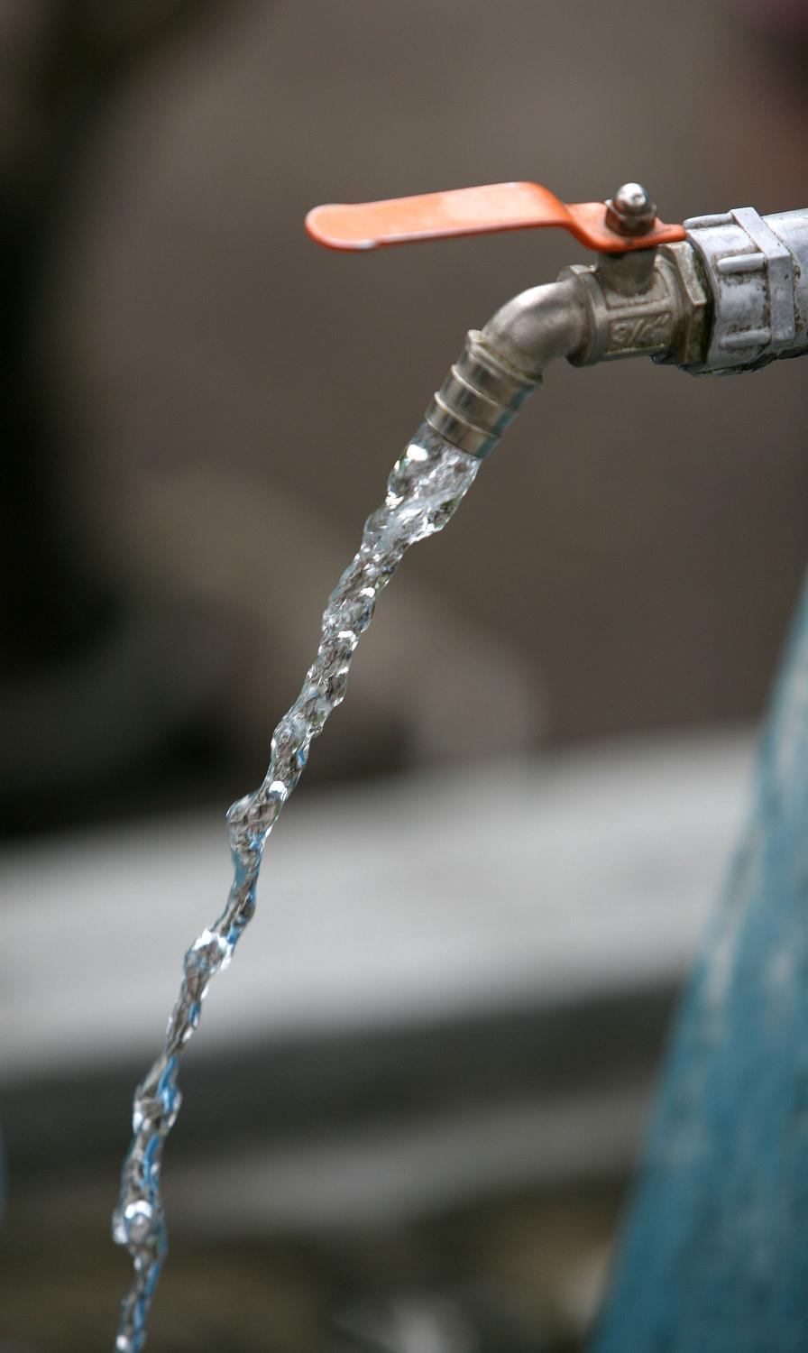 Person collecting water from a river